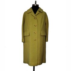 Lovely 1960’s Dumas Of California Coat, In A Quite Uncommon Light Chartreuse Hue. The Fabric Is A Slubby Weave Boucle Wool Or Wool Blend With A Horizontal Pattern. Has Drop Shoulder, Bracelet Length Sleeves, 4 Yellow Celluloid/Plastic Buttons With Rhinestones And Two Flaps Give The Impression Of Pockets But Real Pockets Are Welt Style At The Side. Coat Is Fully Lined In A Silky Yellow Taffeta Or Faille Fabric. Excellent Condition, 2 Stones Missing From 2nd Button, Stains On Lining (See Pics), Has Been Dry Cleaned. Measurement: Taken Flat Across - Size Small/Medium, Please Use Measurements Shoulder-18"/Sleeve-20"/Bust-20.5"/Waist-20"/Hip-21.5"/ Length-36" Retro Green Formal Outerwear, Formal Vintage Yellow Outerwear, Vintage Outerwear With Covered Buttons For Spring, Vintage Spring Outerwear With Covered Buttons, Vintage Outerwear With Covered Buttons For Work, Vintage Outerwear With Buttons For Daywear, Retro Outerwear With Buttons For Daywear, Retro Daywear Outerwear With Buttons, Shoulder Bracelet