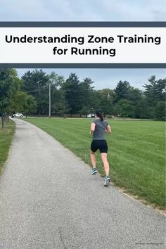 a woman running down a path with the words, understand zone training for running on it