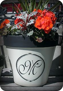 a flower pot that has some flowers in it