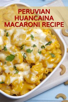 a bowl filled with macaroni and cheese on top of a blue tablecloth