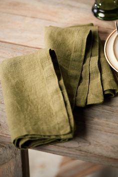 Handmade from super-soft Lithuanian linen, this pre-washed napkin set is a welcome addition to the table. Easy to care for, each napkin just gets better with age. | Lithuanian Linen Napkins, Set of 2 in Green at Terrain Lithuanian Culture, Bee Napkins, Table Wear, Plaid Tablecloth, Embroidered Napkins, Leather Apron, Hand Poured Candle, Fine Linen, Gray Linen