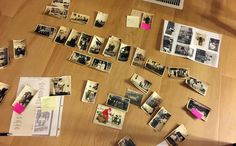 many old photos and postcards are scattered on the floor