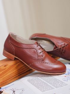 ✔️ 100% Leather (calfskin) ✔️ The SIZE of the heel in the photo is a 2 cm wooden heels. ✔️The WOMEN OXFORDS model is available in 3 types of heels: 2 cm wooden heels, 4 cm wooden heels and 4 cm leather covered heels. Please indicate which heel you selected. ✔️ Optional OUTSOLE: Stout leather for dance, Neolite synthetic for dance & casual, Rubber for street. ✔️ Soft CUSHIONED INSOLE: We insert 3-4 mm pads in all shoes to make them soft & comfortable. ✔️ We make CUSTOMIZED shoes both for STANDARD Vintage Oxford Shoes Women, Classic Brown Lace-up Shoes With Low Heel, Low Heel Lace-up Shoes With Leather Sole For Work, Vintage Leather Shoes With Brogue Detailing And Flat Heel, Workwear Loafers With Wooden Heel And Round Toe, Brown Flat Heel Oxfords For Formal Occasions, Leather Loafers With Wooden Heel For Work, Almond Toe Oxfords With Leather Footbed For Galas, Brown Oxfords With Flat Heel For Formal Occasions