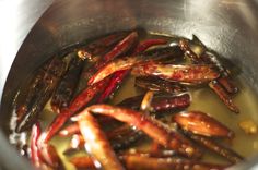 the food is being cooked in the pot on the stove top, and ready to be eaten