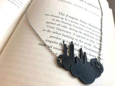 Show your favorite city no matter where your travels may take you... This necklace features multiple landmarks from New York City.