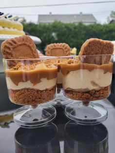 three desserts sitting on top of each other in glasses