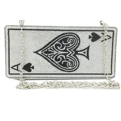 a white purse with black and white designs on it