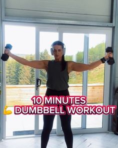 a woman doing dumbbell exercises with headphones on her ears and arms, in front of an open door