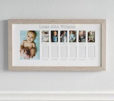 a baby's first year photo hanging on the wall above a fireplace mantel