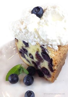 a piece of blueberry cheesecake with whipped cream on top