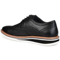 A dress shoe that combines high-style with all-day comfort, the Warrick by Vance Co. A wingtip accent and a contrasting textured design enhanced with brogue details tops this lace-up derby. Smooth vegan leather, a lightweight EVA outsole, and a 4 mm memory foam footbed provide superior support. Casual Black Dress Shoes With Brogue Detailing, Black Wingtip Oxfords For Spring, Black Oxfords With Contrast Sole For Work, Black Oxfords With Contrast Sole For Spring, Black Dress Shoes With Perforated Toe Box For Work, Black Dress Shoes With Perforated Toe For Work, Black Wingtip Dress Shoes With Contrast Sole, Black Oxfords With Contrast Sole For Business Casual, Business Casual Black Oxfords With Contrast Sole