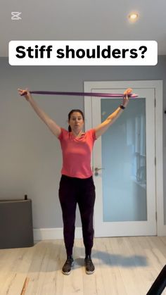 a woman holding a bar in her hands with the words stiff shoulders? above her head