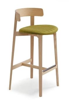 a wooden bar stool with a green seat pad on the back and armrests