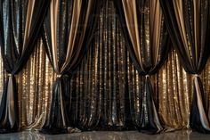 an image of gold and black curtains with lights in the background stock photo - rights