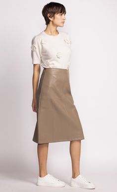 The Peyton Skirt is a chic mid-length faux leather piece that adds a touch of sophistication to any outfit. Style it with a tucked-in blouse and heels for a polished look! Material: 55% PU, 45% Polyester Tapered panel detail Back zip closure Model is wearing XS Vegan Leather Skirt, Pink Martini, Swimsuit With Shorts, Leather Skirts, Swimsuit Dress, Thick Heel, Effortless Look, Leather Pieces, Skirts And Dresses