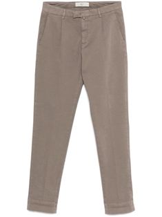 desert rat brown stretch-cotton concealed fly and button fastening belt loops two side inset pockets pleat detailing two rear jetted pockets slim cut turn-up hem Brown Chinos With Pockets And Straight Hem, Classic Tapered Pants With Belt Loops, Classic Beige Pants With Patch Pockets, Classic Chino Cotton Twill Bottoms With Patch Pockets, Classic Tapered Pants With Pockets, Brown Tapered Leg Chinos With Welt Pockets, Brown Straight Chinos With Belt Loops, Brown Tapered Leg Chinos With Belt Loops, Classic Brown Straight Chinos