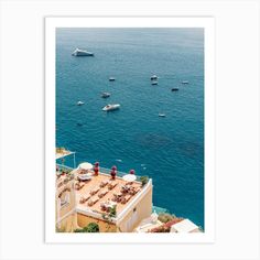 an aerial view of boats in the ocean