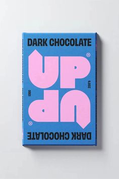 a blue and pink book with the words dark chocolate up on it's cover