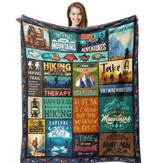 a woman holding up a blanket with many different things on it