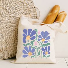 ABOUT OUR TOTE BAGS: This 100% cotton bag comes in one size - 15" x 16"- perfect for everyday wear. The bag features 20" handles (made from the same canvas), making it easy to carry even with a week's worth of shopping. .: 100% cotton canvas .: Heavy fabric (12 oz/yd² (406.9 g/m .: Sewn-in label .: Design is only in the front side of bag *Listing uses mockups photos that depict the final product* CARE INSTRUCTIONS: Do not iron directly over the printed area - print may stick to the iron.; Spot c Tote Bag Summer, Summer Tote Bag, Flower Tote Bag, Tote Bag Aesthetic, Flower Tote, Bag Craft, Summer Tote Bags, Painted Tote, Aesthetic Flower