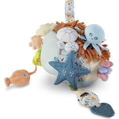 an octopus, starfish, and other stuffed animals are on the top of a ball