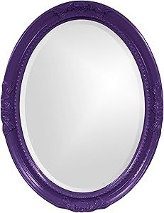 a round mirror with an ornate design on the front and sides, painted in purple