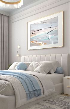 a bedroom with a large bed and a painting on the wall above it's headboard