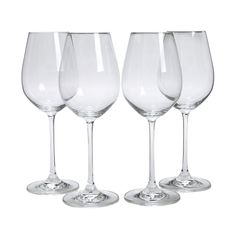 four empty wine glasses sitting next to each other