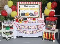 a movie night party with balloons and decorations