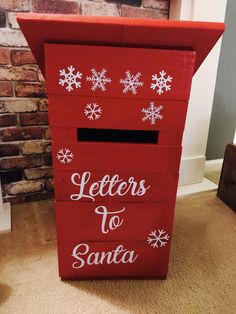 a red letter to santa box with snowflakes on the top and letters written in white