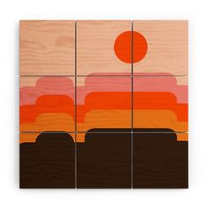 four pieces of wood with an orange and brown painting on them, each piece has different shapes