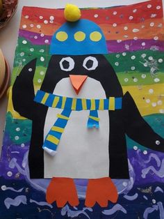 a penguin with a blue hat and scarf on it's head is standing in front of a colorful background