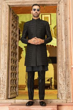 Black longline bandhgala with paneled, structured front, grid pattern pintucks and tonal bead embroidery. Comes with matching kurta and pant. - Aza Fashions Grid Pattern, Bead Embroidery, Pin Tucks, Raw Silk, Long A Line, Aza Fashion, Beaded Embroidery, For Men, Silk