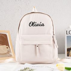 ⭐Production usually takes 10 business days. Hey there, mini adventurers and tiny trendsetters! Whether you're heading to school, playdates, or grand adventures, this backpack is the ultimate companion for all your dreams. ⭐Size: 10'' x 5'' x 14.5'' | Colors: Pink, White, Green, Blue, Black ⭐Your Name, Your Magic: Add your name, initials, or a fun design to create a backpack that's unmistakably yours.  ⭐Clever Pockets for Mini Explorers: The backpack is a treasure trove of pockets and compartment Back To School Backpack With Letter Print For Students, Letter Print Backpack For Travel, White Letter Print Backpack For Back To School, Everyday White Backpack With Letter Print, Back To School White Letter Print Backpack, White Letter Print Backpack For Students, Student Bags With Letter Print For Back To School, Casual Personalized Travel Backpack, School Backpack With Letter Print