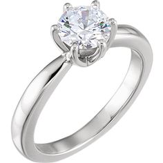 a white gold engagement ring with a single diamond