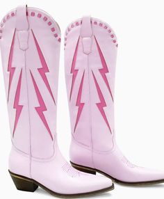 The Dolly - Looking for a pair of cowboy boots that are both stylish and unique? Our pink lightning cowboy boots are just what you need! These boots are made from high-quality material and feature a vibrant pink lightning bolt design on the sides. The boots have a classic western shape with a pointed toe, making them perfect for both casual and dressy occasions. The sturdy rubber outsole provides added traction and support, while the interior is lined with a soft fabric to keep your feet comfortable all day long. These boots are a statement piece that will surely turn heads and make any outfit electric. Whether you're looking to add a pop of color to your outfit or just want to stand out from the crowd, these pink lightning cowboy boots are the perfect choice. Order a pair today and let yo Pink Lightning Bolt, Cute Cowgirl Boots, Boy Boots, Sneaker Heels Wedges, Pink Lightning, Consuela Bags, Lightning Bolt Design, Glass Slippers, Pink Boots