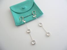 Overview:Offered for sale is a gorgeous and very rare pair of Tiffany and Co. Picasso Silver & Rock Crystal Triple Drop Dangling earrings. This pair is classic and elegant, and looks very pretty when worn. Extremely versatile and comfortable piece! Great pair to wear for work, a night in town, at a party, or just going to dinner with friends in jeans or a pretty dress. The style is classic Tiffany, making it a piece that you will most certainly use over and over again. No longer in productio At A Party, Dinner With Friends, Tiffany And Co, Dangling Earrings, Gift Pouch, Rock Crystal, Night In, Earring Gifts, Very Rare