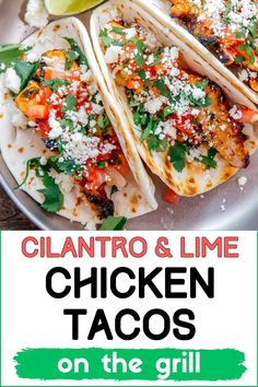 three chicken tacos with cilantro and lime on the side, sitting on a plate