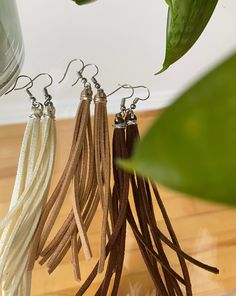 ♡ Our unique and handcrafted suede tassel earrings are perfect for any occasion. They are comfortable and very light. ♡ Each earring is made from silver plated earring hooks and suede. ♡ Care instructions: - Try to avoid wearing them in shower, pool, spa or to bed. ♡ !! Shipping Is Untracked!! Message me if you have any questions or concerns 💕 Cheap Dangle Tassel Jewelry, Cheap Beaded Tassel Dangle Earrings, Cheap Metal Dangle Tassel Earrings, Cheap Tassel Earrings With Dangling Beads For Gifts, Cheap Tassel Dangle Jewelry, Cheap Bohemian Dangle Tassel Earrings, Affordable Handmade Bohemian Tassel Earrings, Dyi Tassel Earrings, Elegant Brown Adjustable Tassel Earrings