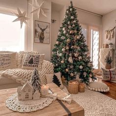 a living room with a christmas tree in the corner and decorations on the coffee table