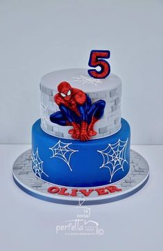 a spiderman birthday cake with the number five on it's top and bottom tier