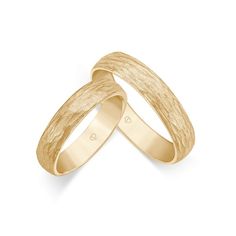 two yellow gold wedding bands on white background