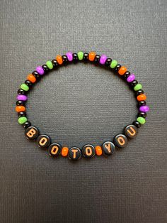 Boo To You beaded stretchy bracelet with glass seed beads in Halloween colors. Perfect for MNSSHP!  Bracelets are available in a variety of lengths.  Pick your custom length from the drop down menu below.  Please be aware that beading may slightly differ from what is pictured as to accommodate selected sizing.  All our bracelets are made with quality in mind.  With that being said, all bracelets should be treated with care while putting on, wearing, and taking off.  Keep dry. Do not swim or bath Halloween Friendship Bracelet Beads, Spooky Bracelet Ideas, Halloween Kandi Ideas, Halloween Seed Bead Bracelet, Bracelet Ideas Halloween, Bracelet Ideas Glass Beads, Seasonal Bracelets, Bracelet Ideas Seed Beads, Fall Jewelry Ideas