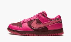 The Women’s Nike Dunk Low “Valentine’s Day” is a women’s-exclusive release of the classic sneaker in a unique colorway that pays homage to Valentine’s Day. A February 2022 release, the “Valentine’s Day” version of the Dunk Low succeeds popular Dunks that have shown love to the holiday before it, including StrangeLove Skateboards’ collaboration with the Nike SB Dunk in 2020. This “Valentine’s Day” Dunk features a maroon canvas base with pink tumbled leather overlays. A pink suede Swoosh can be fo Dark Fuschia, Nike X Travis Scott, Matching Colours, Low Air Jordan 1, Team Red, Dunks Nike, Nike Shox, Nike Sb Dunks, Air Huarache