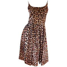 Gorgeous vintage 1950s demi couture leopard/cheetah print fit and flare silk dress! This is one bombshell of a dress, and is a classic beauty! Features allover animal print. Fitted bodice with a full forgiving skirt. Full metal zipper up the back with hook-and-eye closure. So much detail went into the construction of this rare gem! Most of the sewing was completed by hand. Great belted or alone, and perfect for any day or evening event. Pair with flats, sandals or wedges for day, and heels for e Demi Couture, Fit And Flare Cocktail Dress, Leopard Print Fashion, Silk Dress Vintage, Silk Cocktail Dress, Cocktail Dress Vintage, Vintage 1950s Dresses, 50s Dresses, Couture Dresses