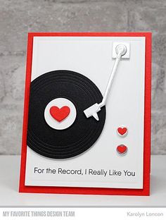 a handmade card with a record and heart on it