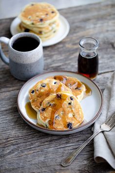 pancakes with blueberries and syrup on a plate