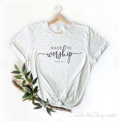 a t - shirt with the words made to worship on it next to some leaves