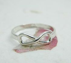 FOREVER RINGDelicate sterling silver INFINITY ringThe ring is made of solid sterling silver 925 with a shiny finish.This ring can be wear as a staking ring.The width is 5 mm at The top, and 2.5 mm at the bottom.The ring can be ordered in U.S. sizes 7-9. Please choice your size at check our page.*If you need it a different size please convo with me first. Sterling Silver Infinity Ring Gift, Sterling Silver Infinity Ring, Silver Hypoallergenic Infinity Ring, Sterling Silver Infinity Promise Ring, Dainty Silver Ring, Silver Infinity Ring, Birthday Gift For Girlfriend, Wide Silver Ring, Forever Rings