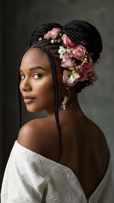 an african woman with braids and flowers in her hair, wearing a white top